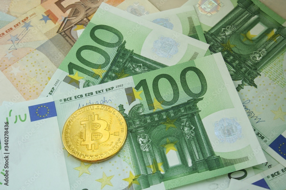 Golden bitcoin coin on euro bankcote. Finance and banking concept. Economy investment. Golden bitcoin coin on euro bankcote. Finance and banking concept. Economy investment.