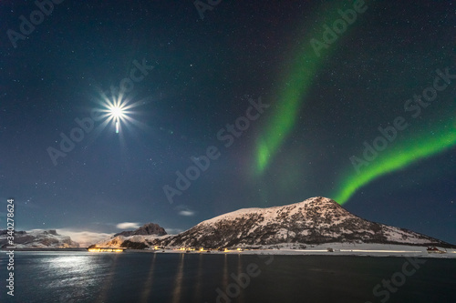 Tableau sur toile Amazing Aurora Borealis  during a cold arctic night on Lofoten Islands archipela