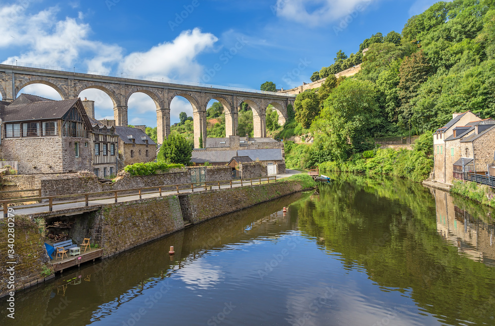 Dinan, France. Viaduct across the Rance river. In the background a medieval fortress