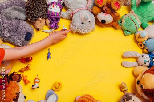 children's toys for development and games boys and girls yellow background