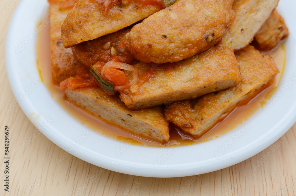 Fishcake fried with tomato sauce in plate Fishcake fried with tomato sauce in plate