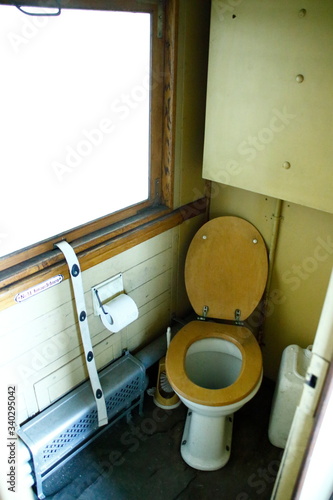 blick in ein altes wc in einem alten eisenbahnwaggon photo