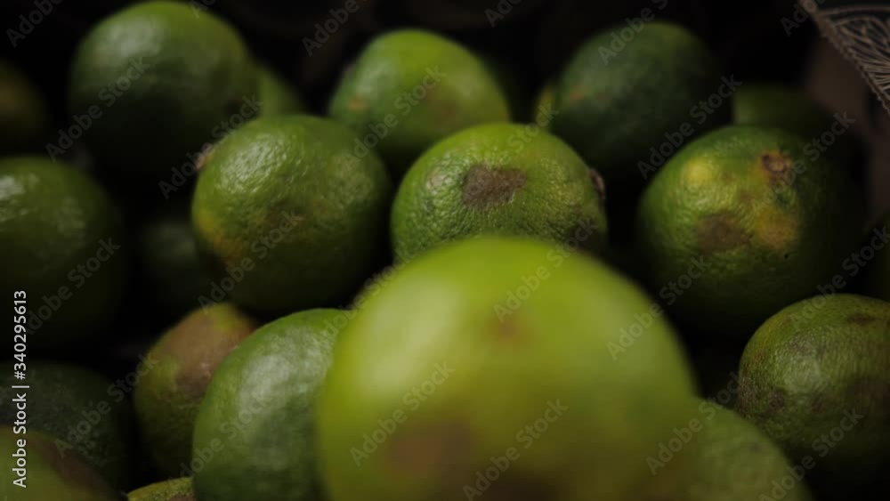 Ripe limes are on the counter of the store. Eco product. Close-up Ripe limes are on the counter of the store. Eco product. Close-up