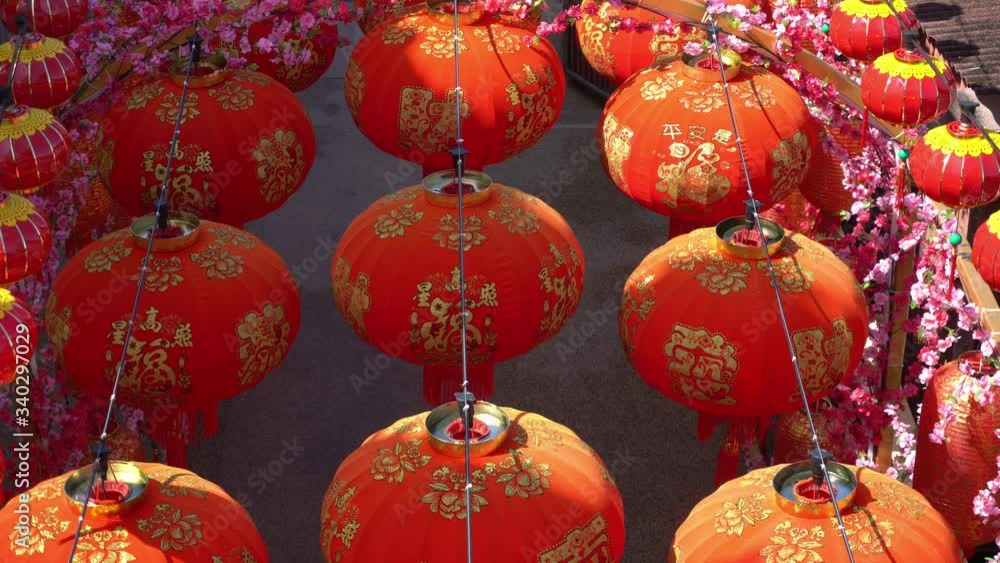 Tilt shot of red lantern decoration at small path. Tilt shot of red lantern decoration at small path.