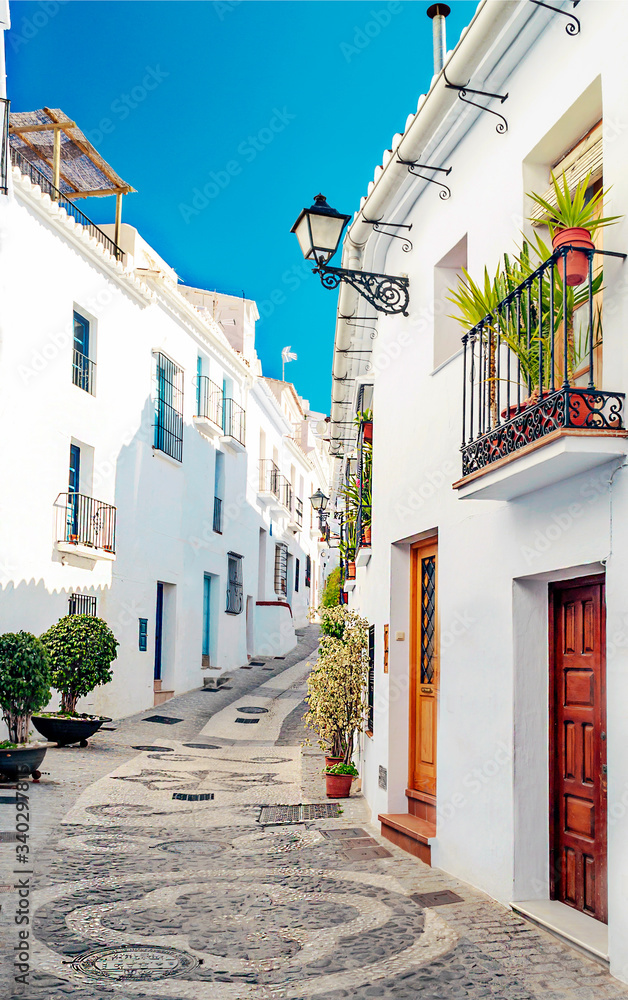 Street of white walls in a village of Andalusia called Frigiliana