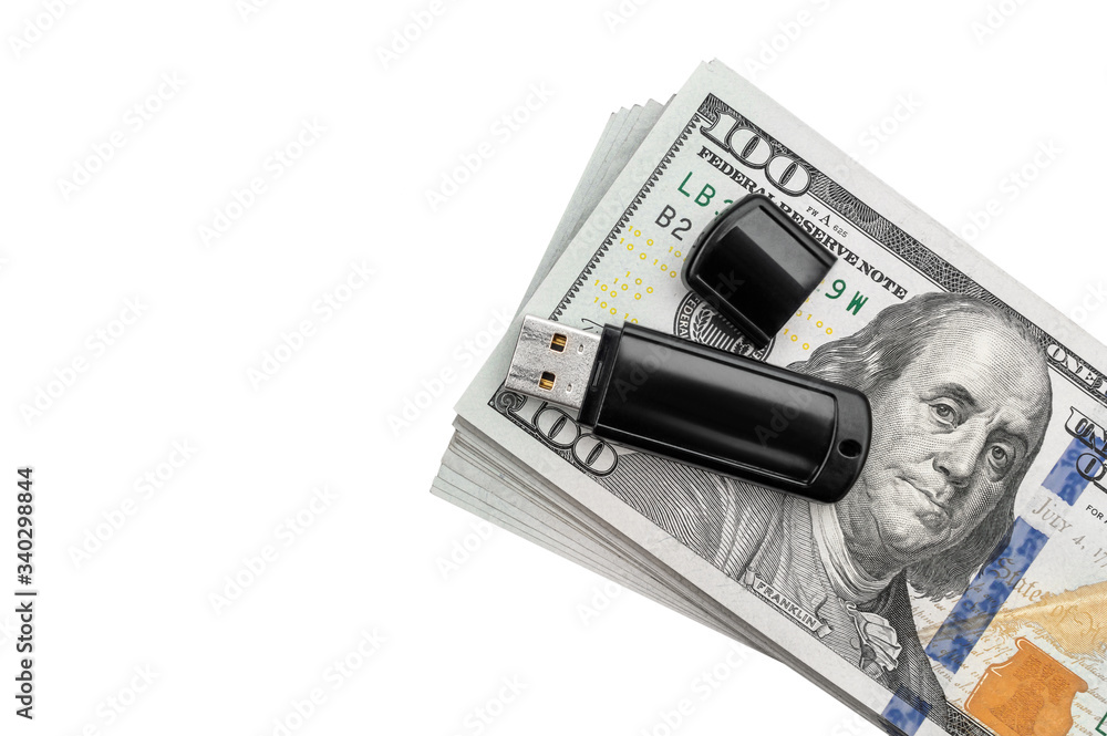 Flash drive on stack of dollar bills. Isolated on white. Flash drive on stack of dollar bills. Isolated on white.