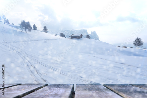 Empty wooden base suitable for mockup. Snow background theme.