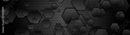 Black hexagons on dark perforated metallic background. Abstract technology banner design. Vector illustration