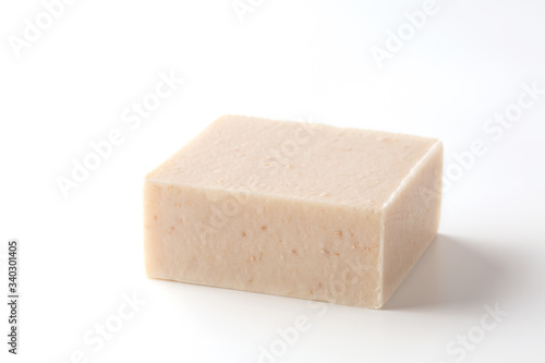 Natural soap scrub with milk, oatmeal and honey on a white background.