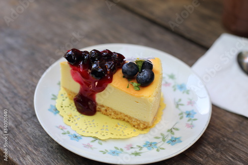 Blueberry cheesecake placed on a flower pattern plate