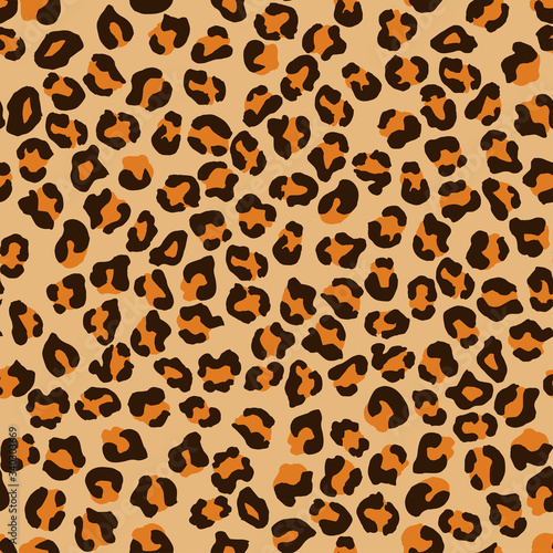 Leopard seamless pattern. Vector animal print. Brown and yellow spots on a beige background. Jaguar, leopard, cheetah, panther fur. Leopard skin imitation can be painted on clothes or fabric.