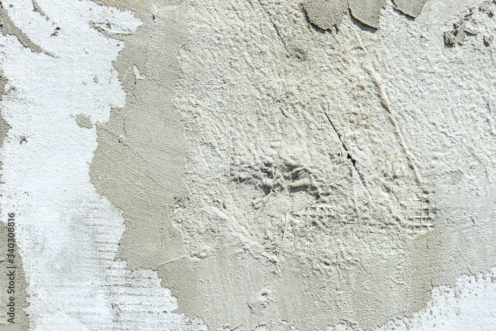 stucco texture on the wall with mesh texture. Grey background.