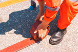 Firefighter or fireman preparing an extinguisher hose, worker in a protective uniform,
