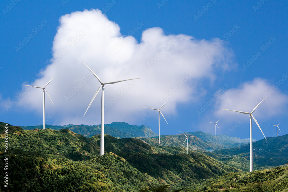 Beautiful green meadow with Wind turbines generating electricity Beautiful green meadow with Wind turbines generating electricity
