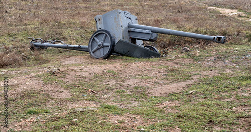 Powerful Military machine gun. Medieval cannon or machinegun on platform in battle field.