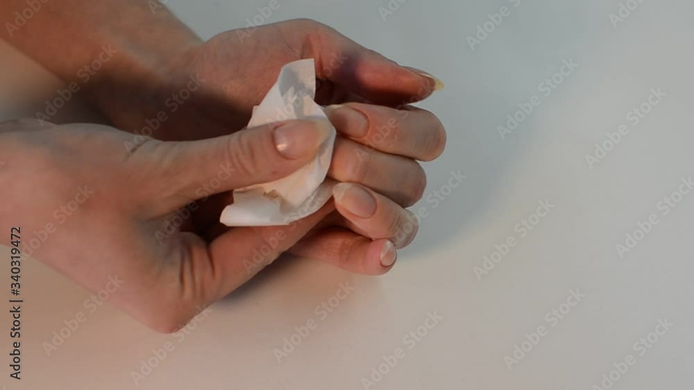 Woman erases nails before manicure Woman erases nails before manicure