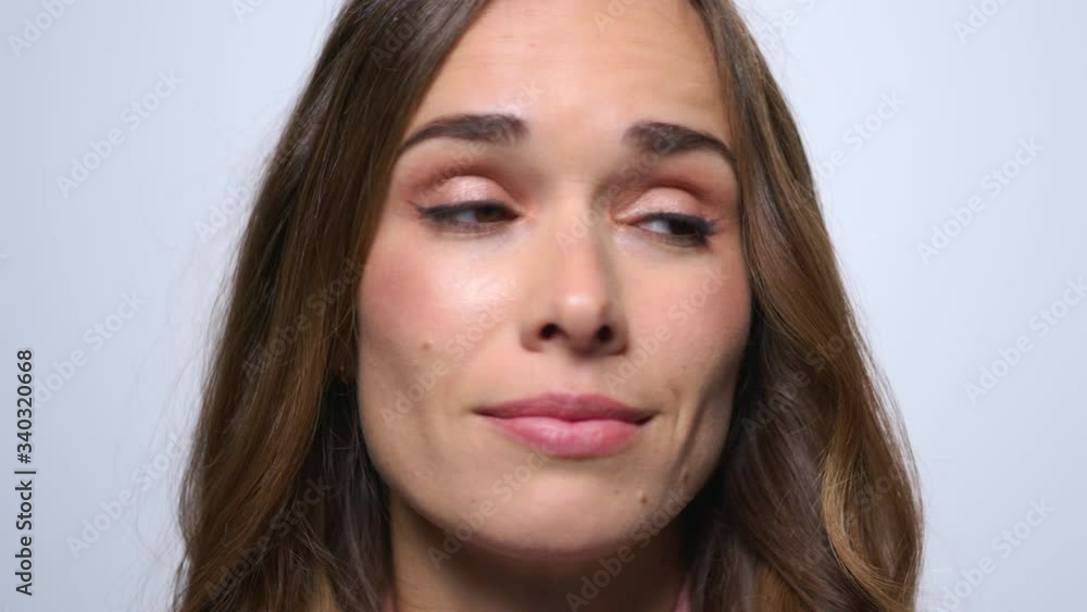 Sick business woman sneezing on blue background. Girl smiling at camera Sick business woman sneezing on blue background. Girl smiling at camera