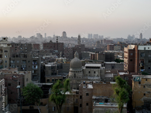 A look over Cairo with its mosques and traditional egyptian buildings from al azhar Park photo