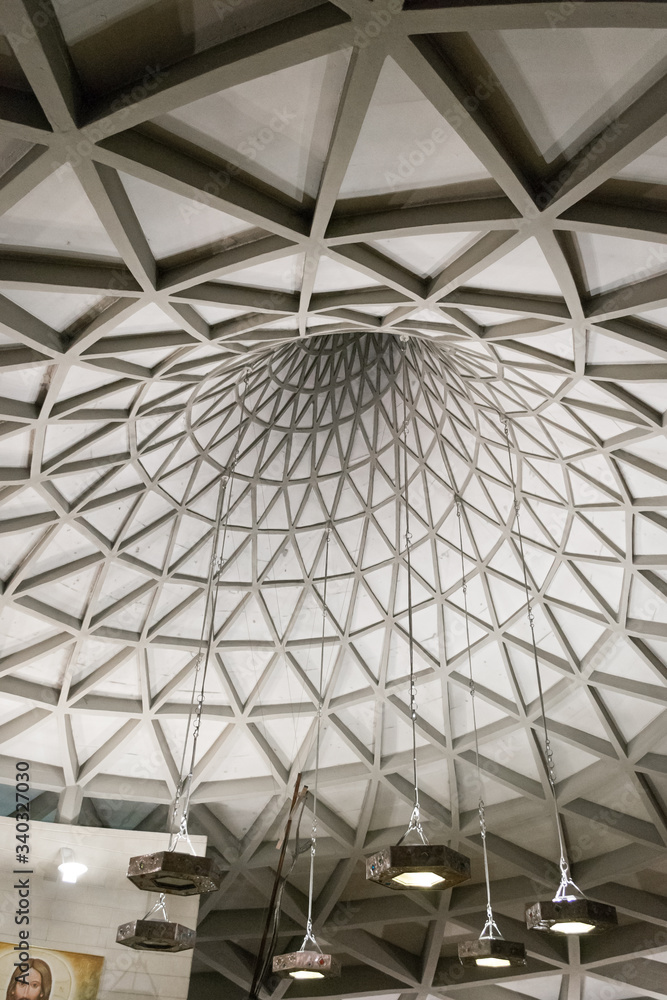 Vicenza, Italy, in the Sun Village, december 2017. Interior view of the interesting small San Carlo church, an architectural concrete experimentation with a curious roof structure in a spiral shape