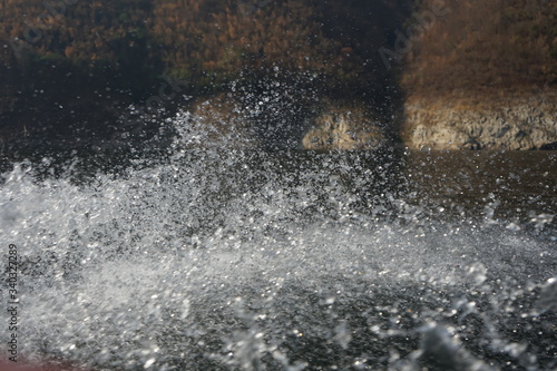 The water splashing from the back of the boat looks beautiful.