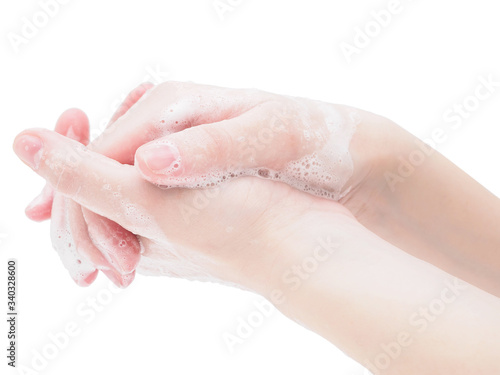 Two hands in disinfectant soap foam close-up on a white background. Wash your hands with soap, be careful, and use protective equipment against coronavirus and flu. Step-by-step instructions