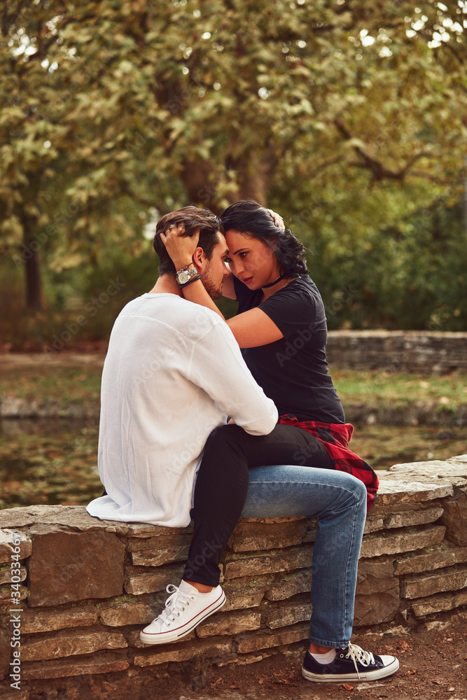 Couple in love hugging and kissing outdoors. Love concept. Couple in love hugging and kissing outdoors. Love concept.