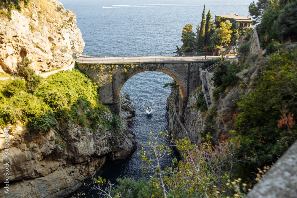 landscape a beautiful place in Italy Amalfi Furore stone bridge over the sea