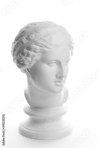 Gypsum copy of ancient statue Venus head isolated on white background. Plaster sculpture woman face.