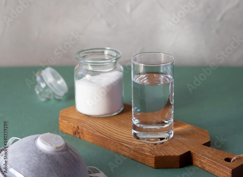 Cuadro en lienzo Glass with salty water to rinse nose and throat as prevention and protection from viruses
