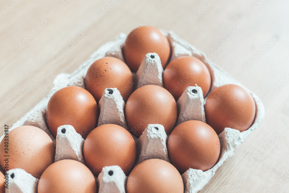 Eggs in a basket for morning breakfast or baking a cake, top view. Eggs in a basket for morning breakfast or baking a cake, top view.