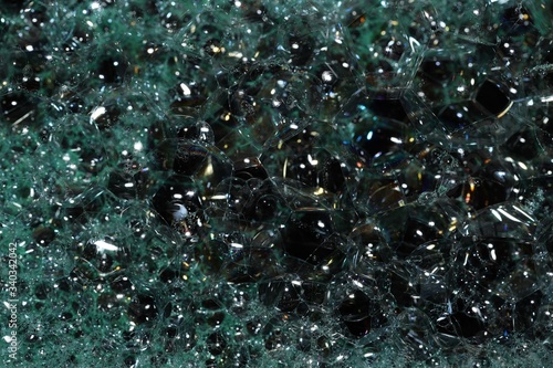 abstract background water foam green on black
