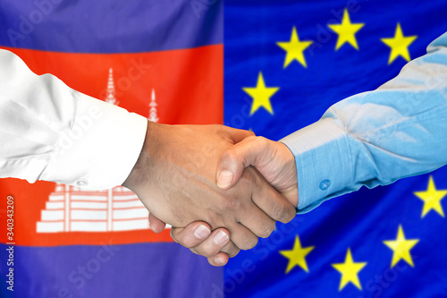 Handshake on Cambodia and European Union flag background. Support concept.