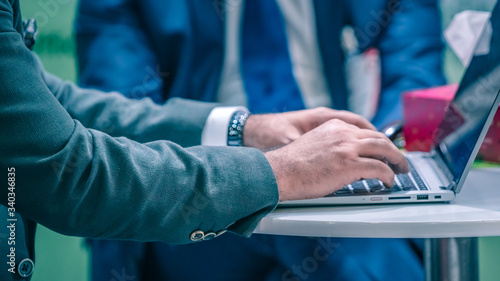 Businessman Working With Laptop At International Trade Fair