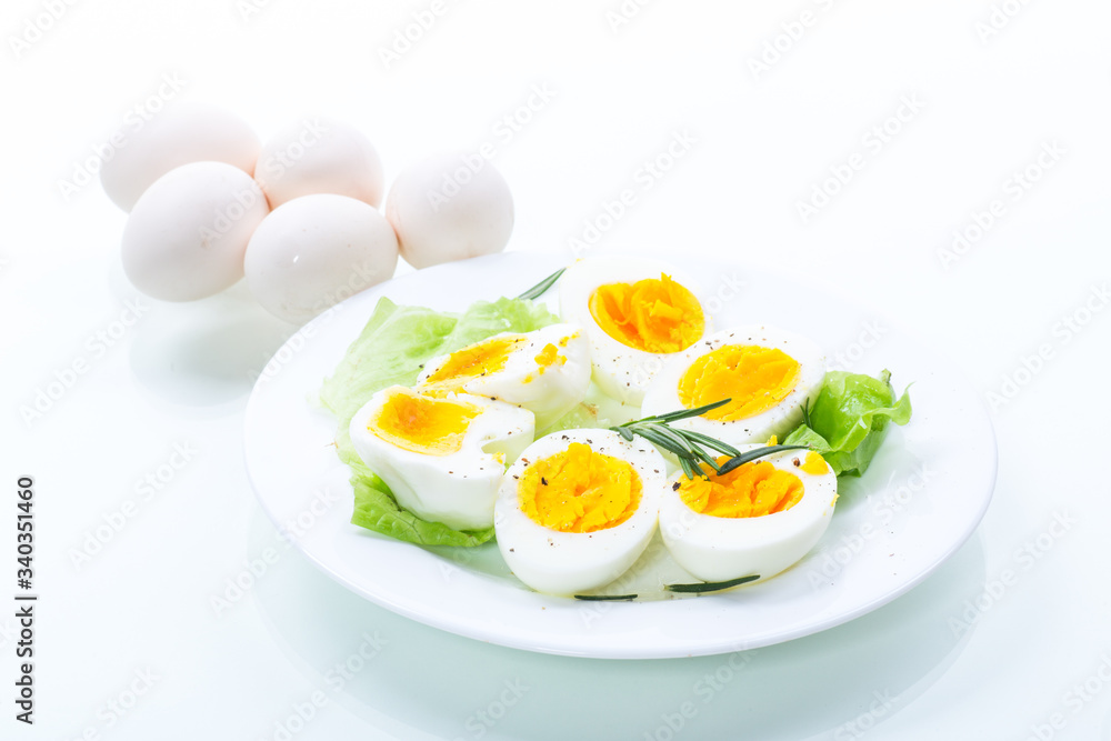 boiled eggs with salad leaves in a plate boiled eggs with salad leaves in a plate