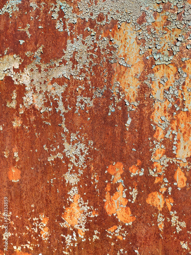 Rusty metal background with streaks of rust. Rust stains. Rystycorrosion. Corroded metal background.