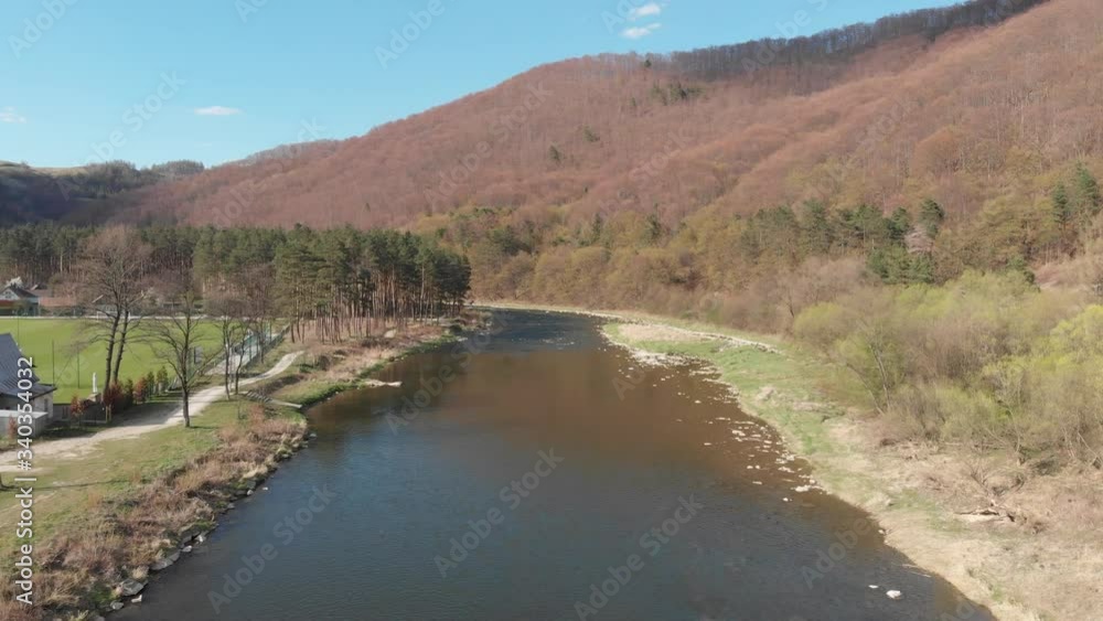 Poprad River in Beskidy Mountains in spring. Village Rytro, Poland. Poprad River in Beskidy Mountains in spring. Village Rytro, Poland.