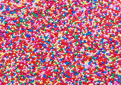 Abstract colorful sugar balls background.Used to decorate baking and sweets. Rainbow-colored sugar chips