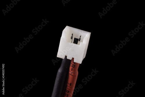 Micro jst 1.25 2 pin female plug isolated on black. Standard connector for small RC vehicles, batteries and motors
