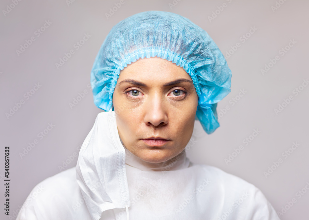 Portrait of a doctor looking seriously. woman in medical uniform, close-up portrait Portrait of a doctor looking seriously. woman in medical uniform, close-up portrait