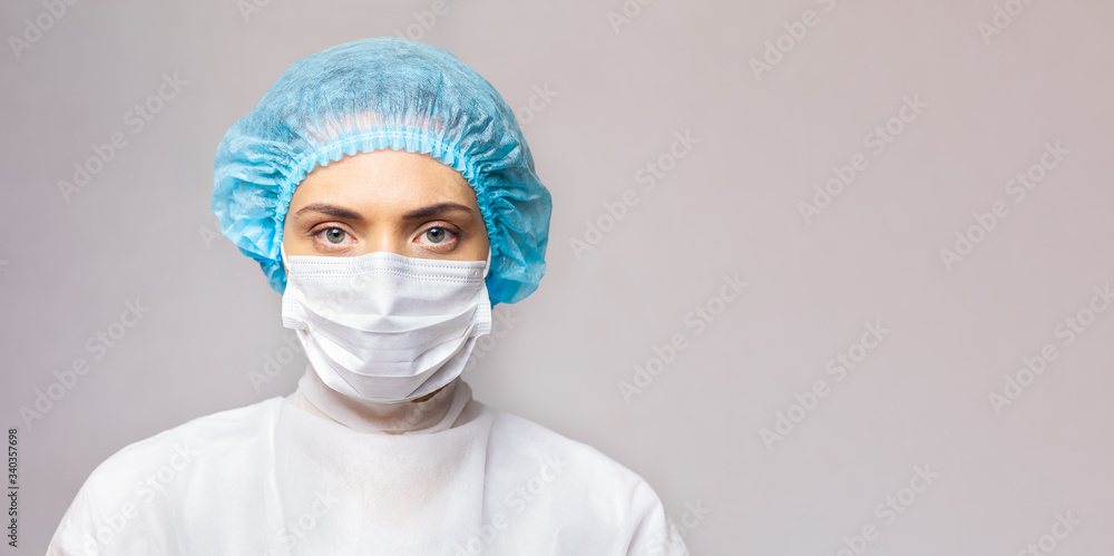 close-up portrait of a serious female doctor in medical uniform on a light background. copy space close-up portrait of a serious female doctor in medical uniform on a light background. copy space