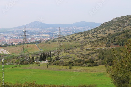 Landscape in the mountains with a city in the distance