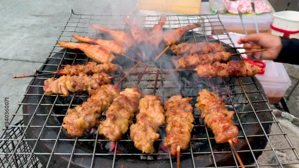 Thailand street food, Thai style grilled pork Popular with sticky rice Is a food that is easy to eat, convenient and fast Thailand street food, Thai style grilled pork Popular with sticky rice Is a food that is easy to eat, convenient and fast