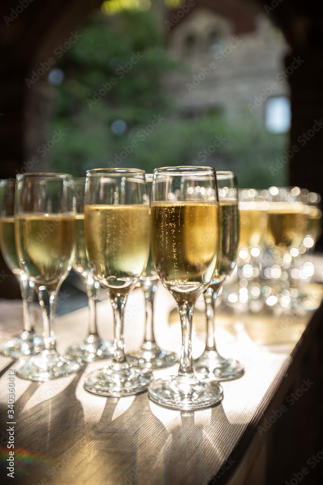 full glasses of champagne on the festive table full glasses of champagne on the festive table