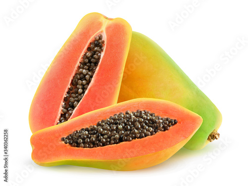 Isolated papaya fruits. One whole papaya and one cut in halve isolated on white background