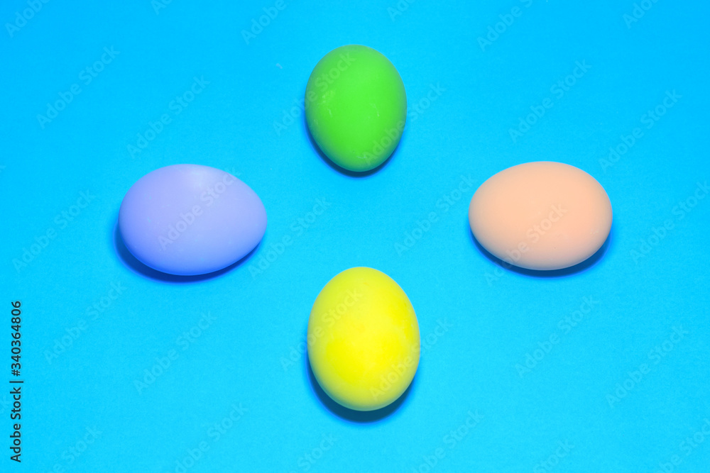 Easter eggs and text space on a blue background. Easter eggs and text space on a blue background.