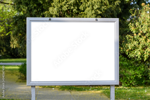 Blank ad space on a sign in a park