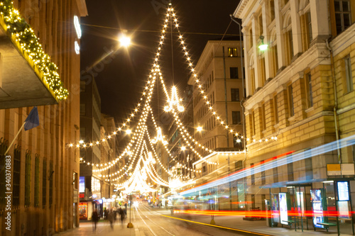 Central street Aleksanterikatu with festive bright illumination and Christmas atmosphere in the city of Helsinki in Finland. The letter 