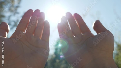 A person raises hands towards the sky and makes a prayer-muslim prayer concept