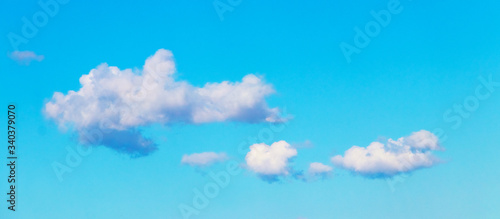 Beautiful fluffy clouds in the blue sky in sunny weather
