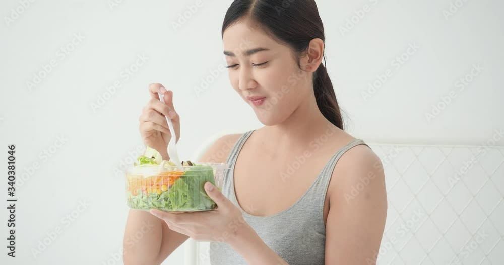 Beautiful asian girl eating detoxify vegetable and fruits. Pretty girl holding blow fruit salad and detox food. Concept of fitness, healthcare, food and drink. Beautiful asian girl eating detoxify vegetable and fruits. Pretty girl holding blow fruit salad and detox food. Concept of fitness, healthcare, food and drink.